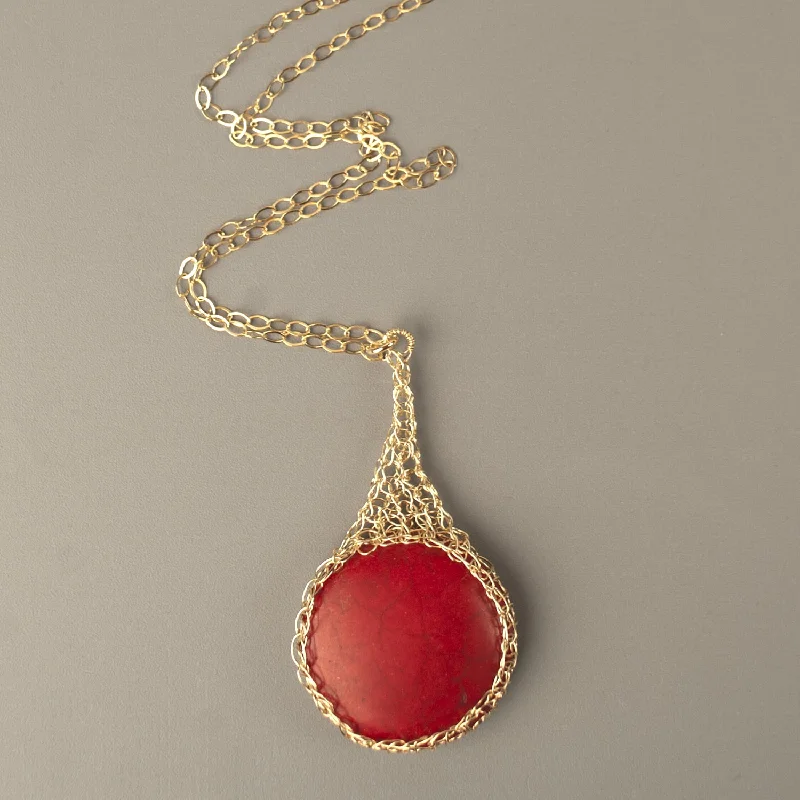 Large round RED Howlite pendant necklace, nested in gold wire crochet